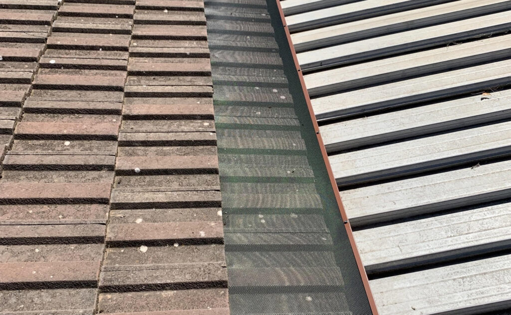 Photo of roof with gutter guard installed